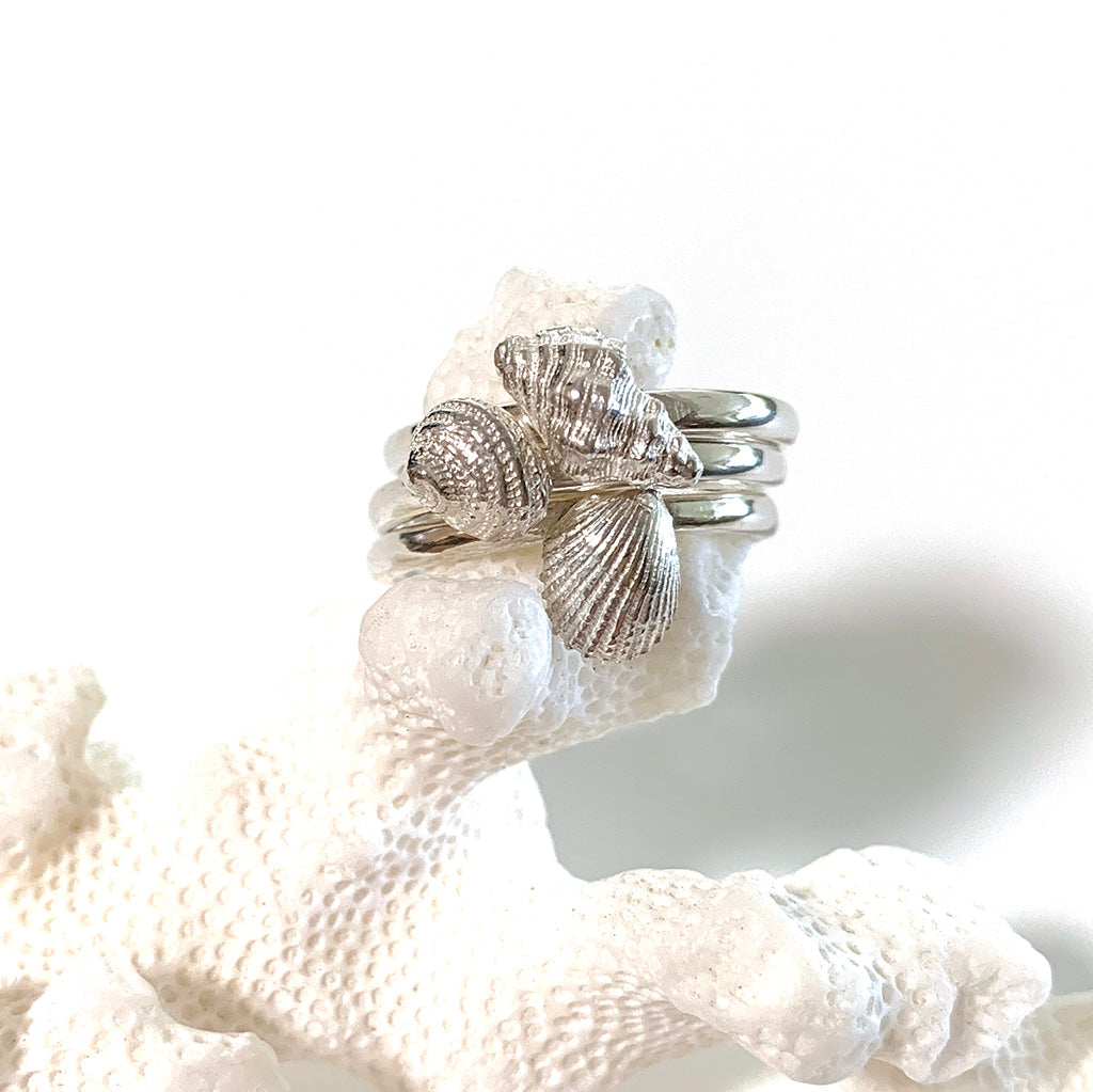 Silver Sea inspired Stacking Rings stacked on coral