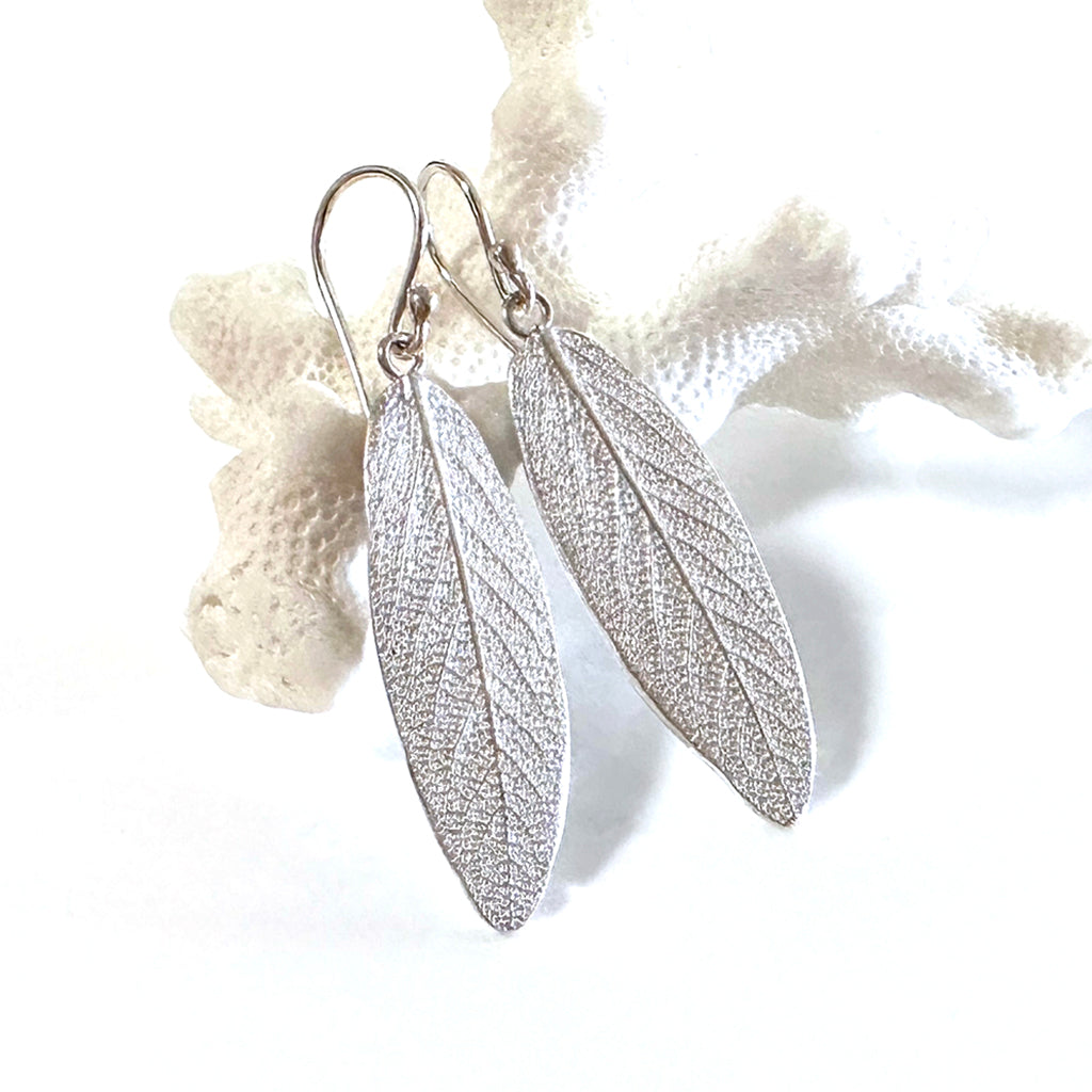 Handcrafted recycled silver Sage Leaf Earrings showing detailed leaf veining and textured surface, displayed against neutral background. Nature-inspired ethical jewelry by Coastalstyle Australia