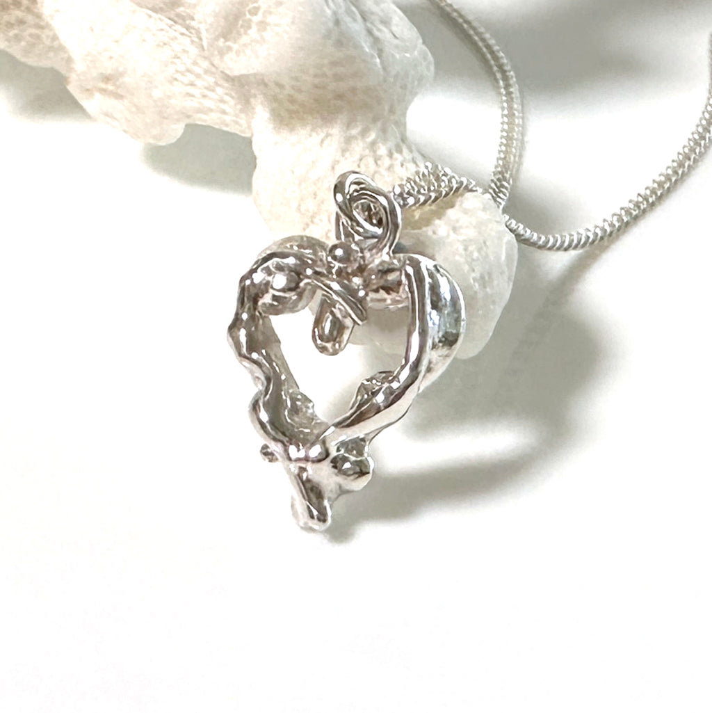 Silver heart shaped necklace inspired by Heart Reef on the Great Barrier Reef