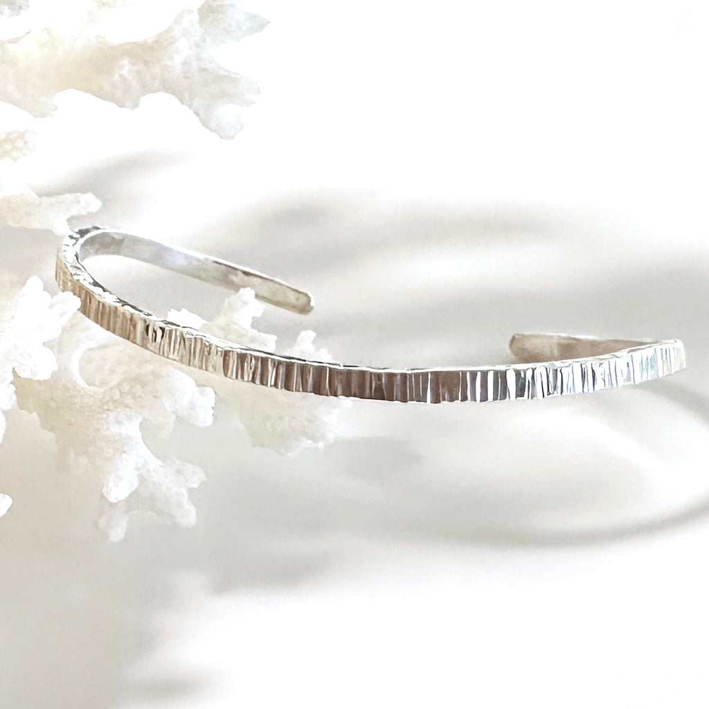 Ethically handcrafted Argentium silver cuff inspired by the movement of the ocean