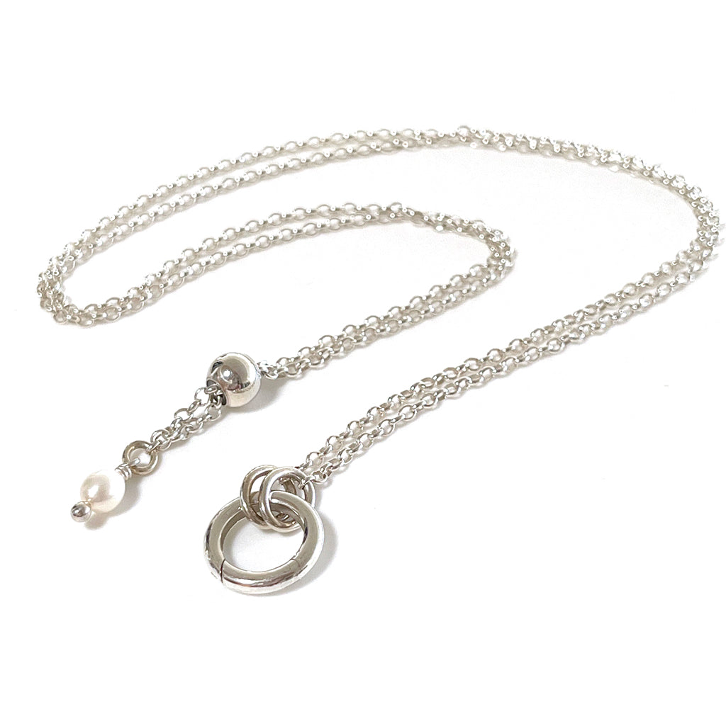 Adjustable Italian silver chain, interchangeable charm holder, and pearl embellishment.