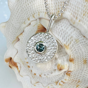 Elegant Ocean Jewel necklace featuring a shimmering blue-green gemstone pendant on sterling silver chain, handcrafted with ethically sourced materials by Coastalstyle Australia