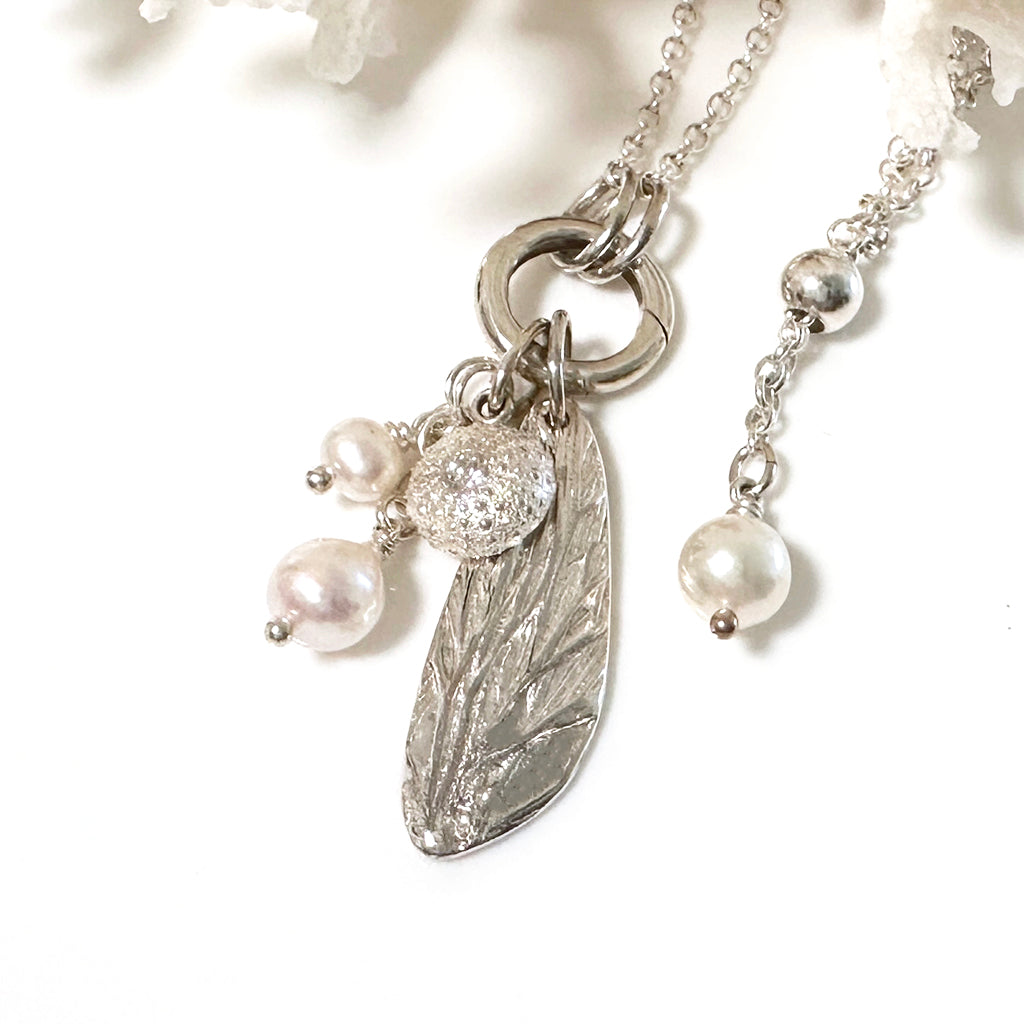 Sea inspired pure silver charms and pearls on an adjustable silver chain