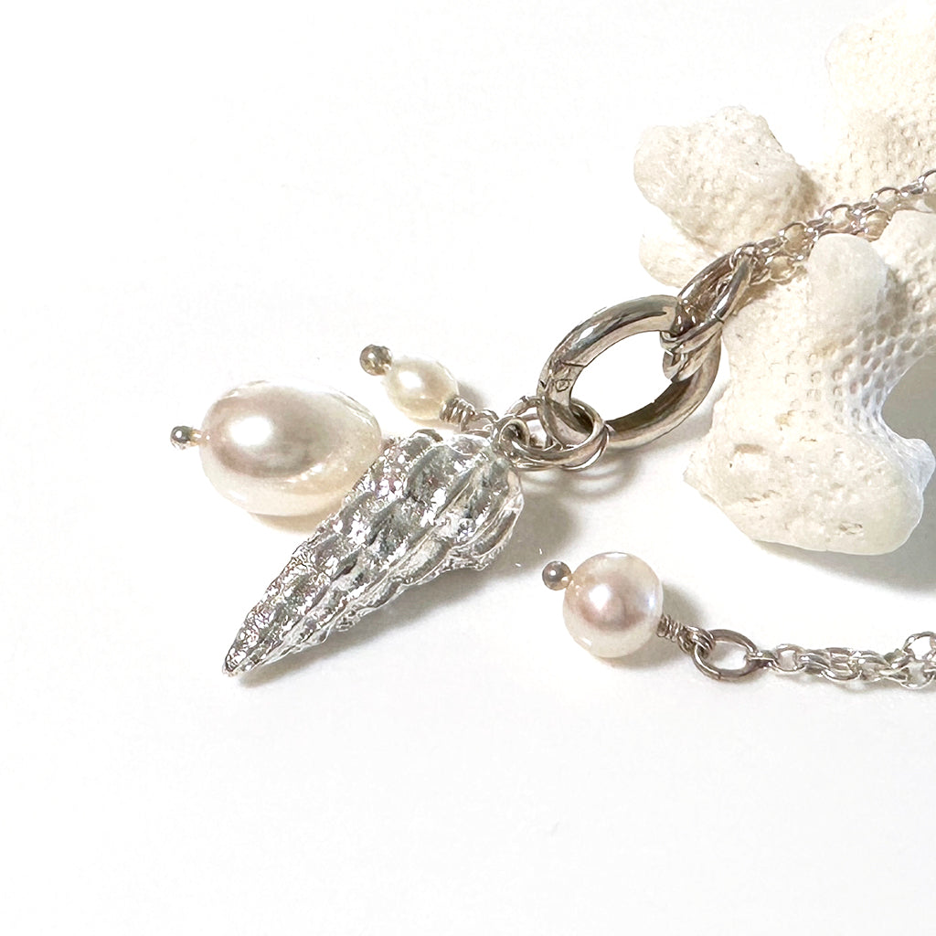 Pure silver sandcast charm necklace with shell with luminous pearl on a sterling silver chain 