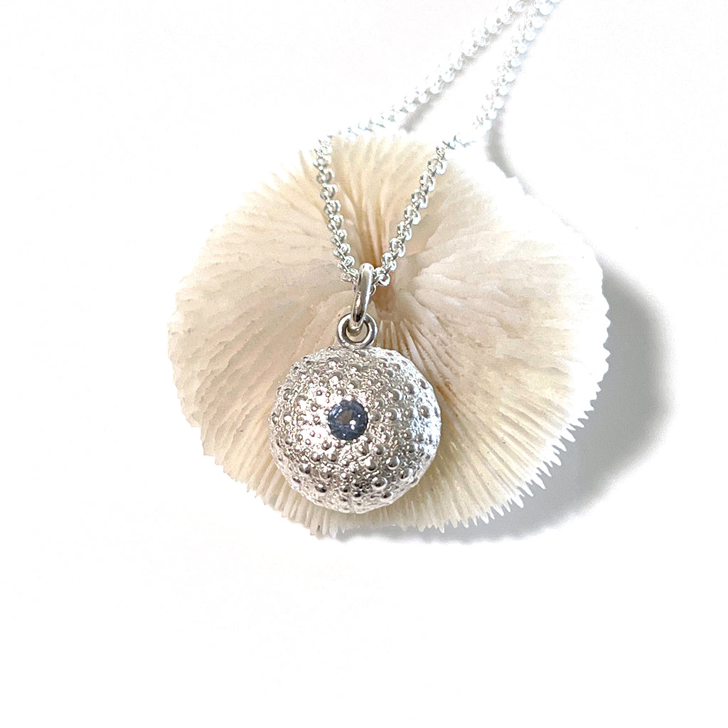 Handcrafted pure silver Sea Urchin Necklace featuring detailed texture molded from real urchin shell, suspended on sterling silver chain with sparkling gemstone accent. Ocean-inspired jewelry by Coastalstyle Australia