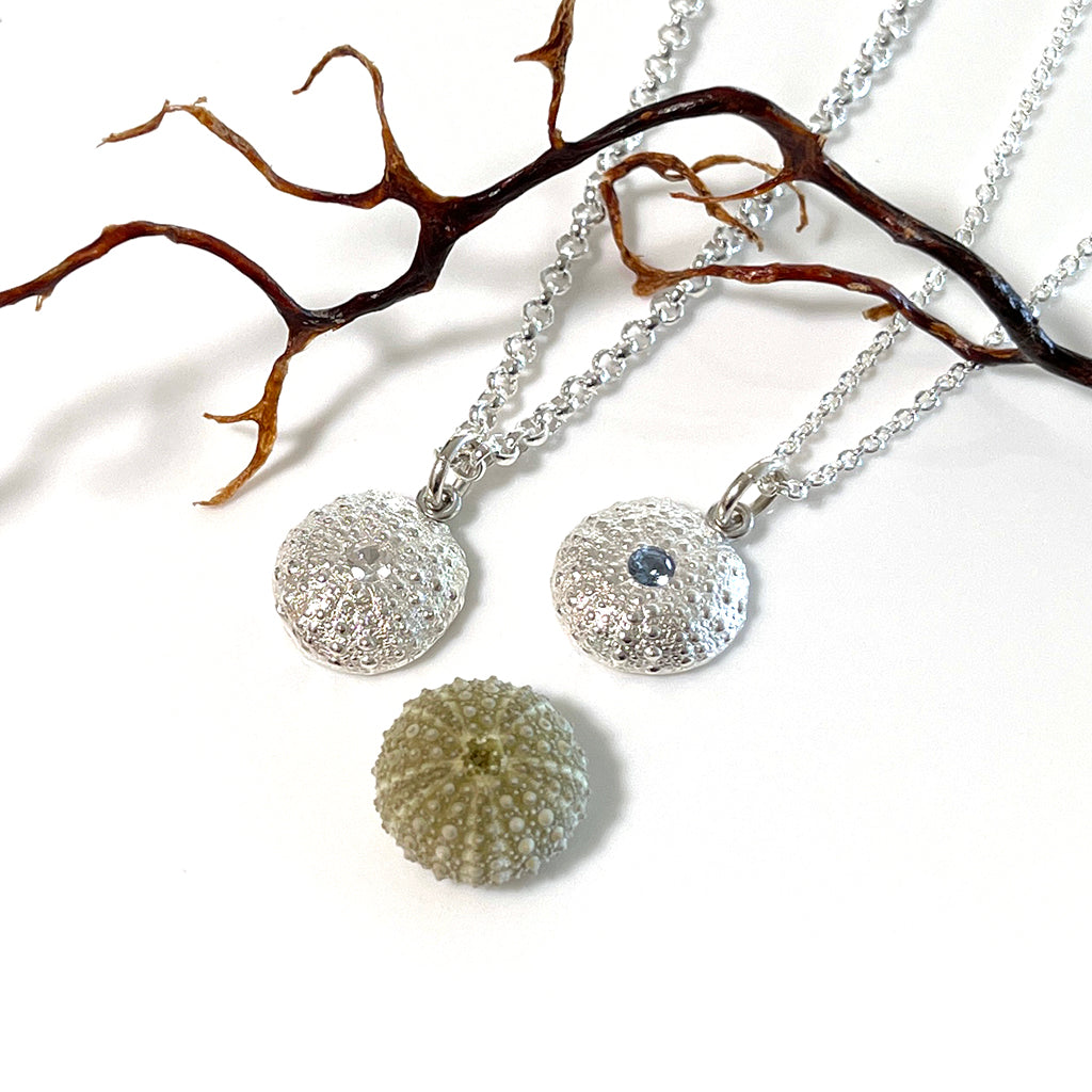 Handcrafted pure silver Sea Urchin Necklace featuring detailed texture molded from real urchin shell, suspended on sterling silver chain with sparkling gemstone accent. Ocean-inspired jewelry by Coastalstyle Australia