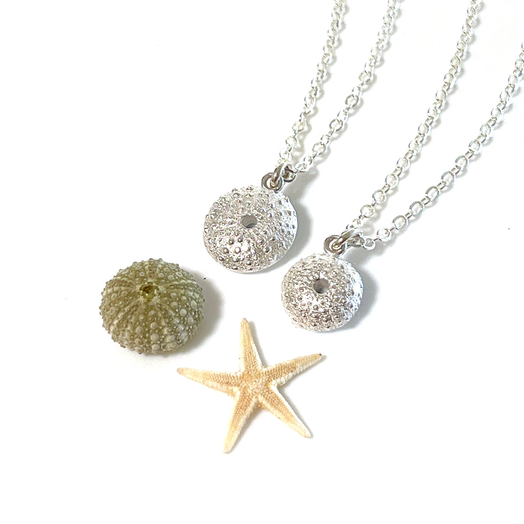 Handcrafted pure silver Sea Urchin Necklace featuring detailed texture moulded from real urchin shell, suspended on sterling silver chain on white background. Ocean-inspired jewellery by Coastalstyle Australia.