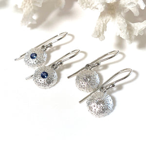 Handcrafted pure silver Baby Sea Urchin Earrings featuring intricate natural texture molded from real tiny urchin shells. Lightweight ocean-inspired jewelry by Coastalstyle Australia shown against neutral background and natural piece of coral.