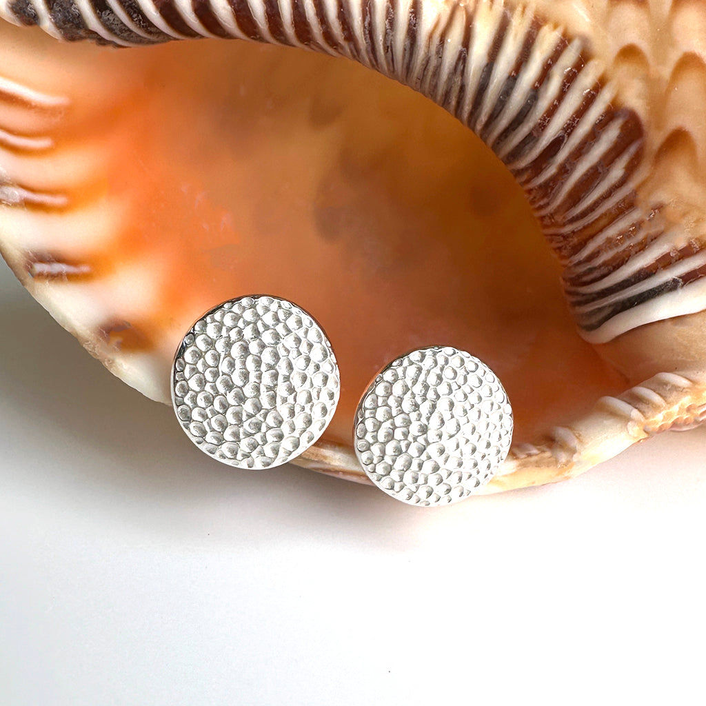 Manta Ray pure silver studs displayed on natural coral. Coastalstyle Australia.