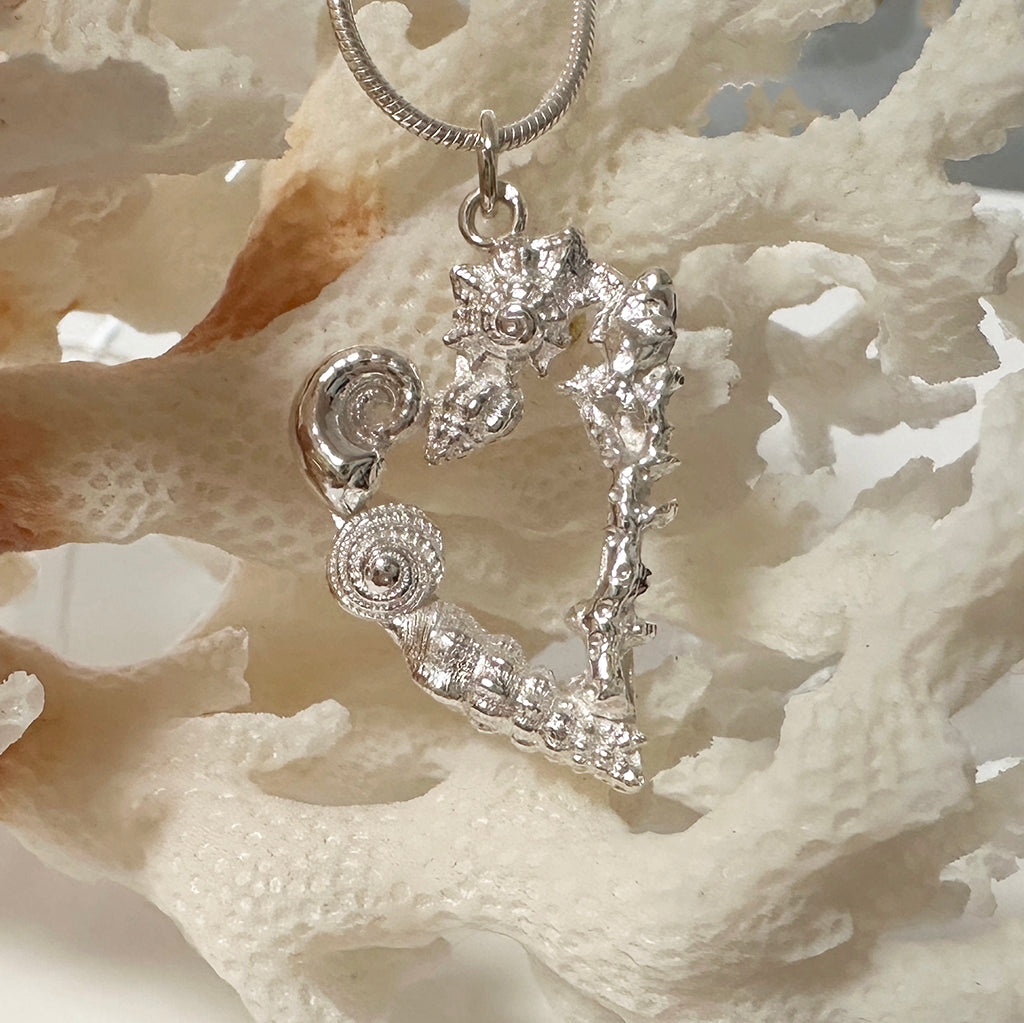 Handcrafted Heart Reef Coral Garden pendant featuring intricate silver coral formations arranged in a heart shape. Great Barrier Reef inspired jewelry by Coastalstyle Australia in tarnish-resistant pure silver 