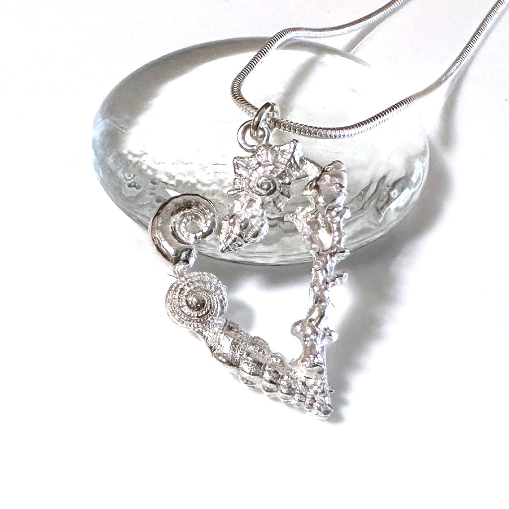 Handcrafted Heart Reef Coral Garden pendant featuring intricate silver coral formations arranged in a heart shape. Great Barrier Reef inspired jewelry by Coastalstyle Australia in tarnish-resistant pure silver 