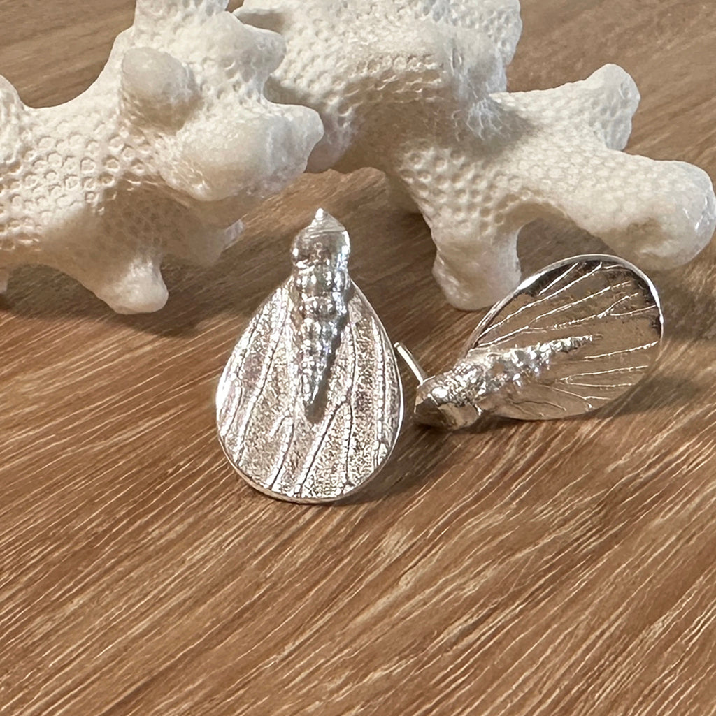 Handcrafted Tidal Reflections earrings showcasing flowing wave-inspired designs in recycled silver with light-catching coral textured surfaces. Ethical ocean-inspired pieces by Coastalstyle Australia 