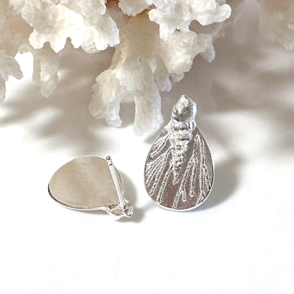 Handcrafted Tidal Reflections earrings showcasing flowing wave-inspired designs in recycled silver with light-catching coral textured surfaces. Ethical ocean-inspired pieces by Coastalstyle Australia 