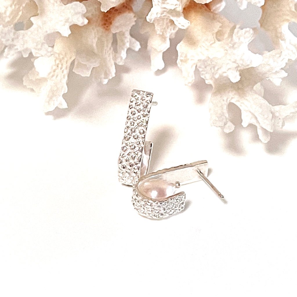 Manta Ray Hoops & Ahoy Pearl Earrings on neutral background