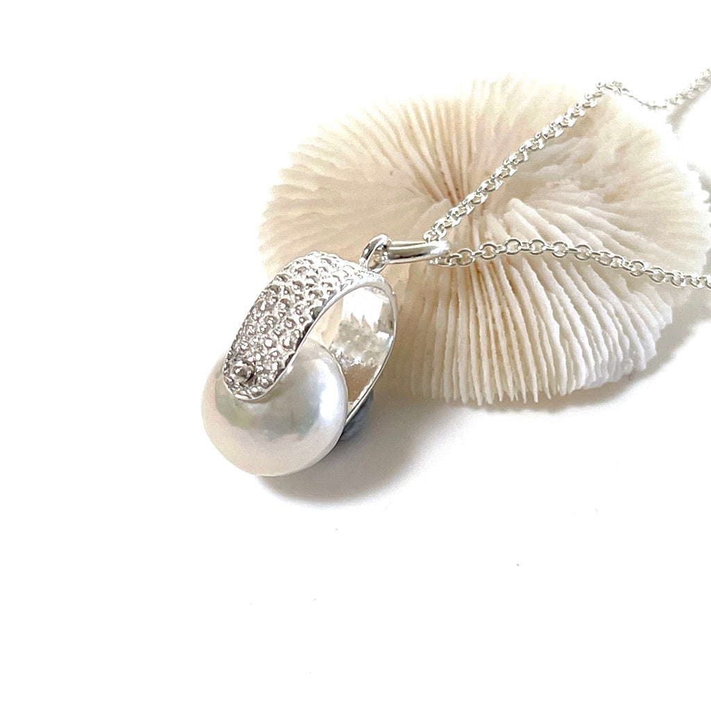 Manta Ray Spinner Pearl Necklace featuring a soft white pearl in pure silver bail with silver chain. Coastalstyle Australia