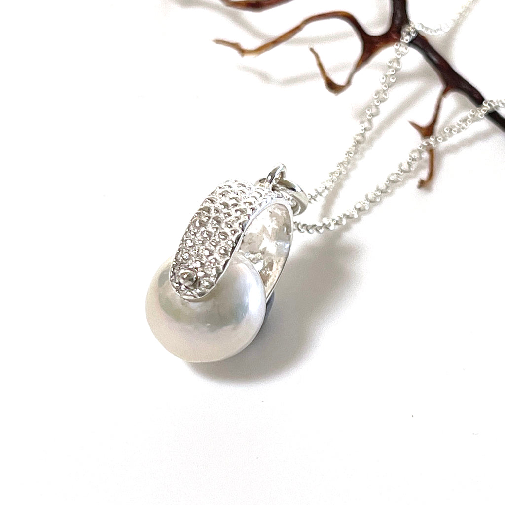 Manta Ray Spinner Pearl Necklace featuring a soft white pearl in pure silver bail with silver chain. Coastalstyle Australia