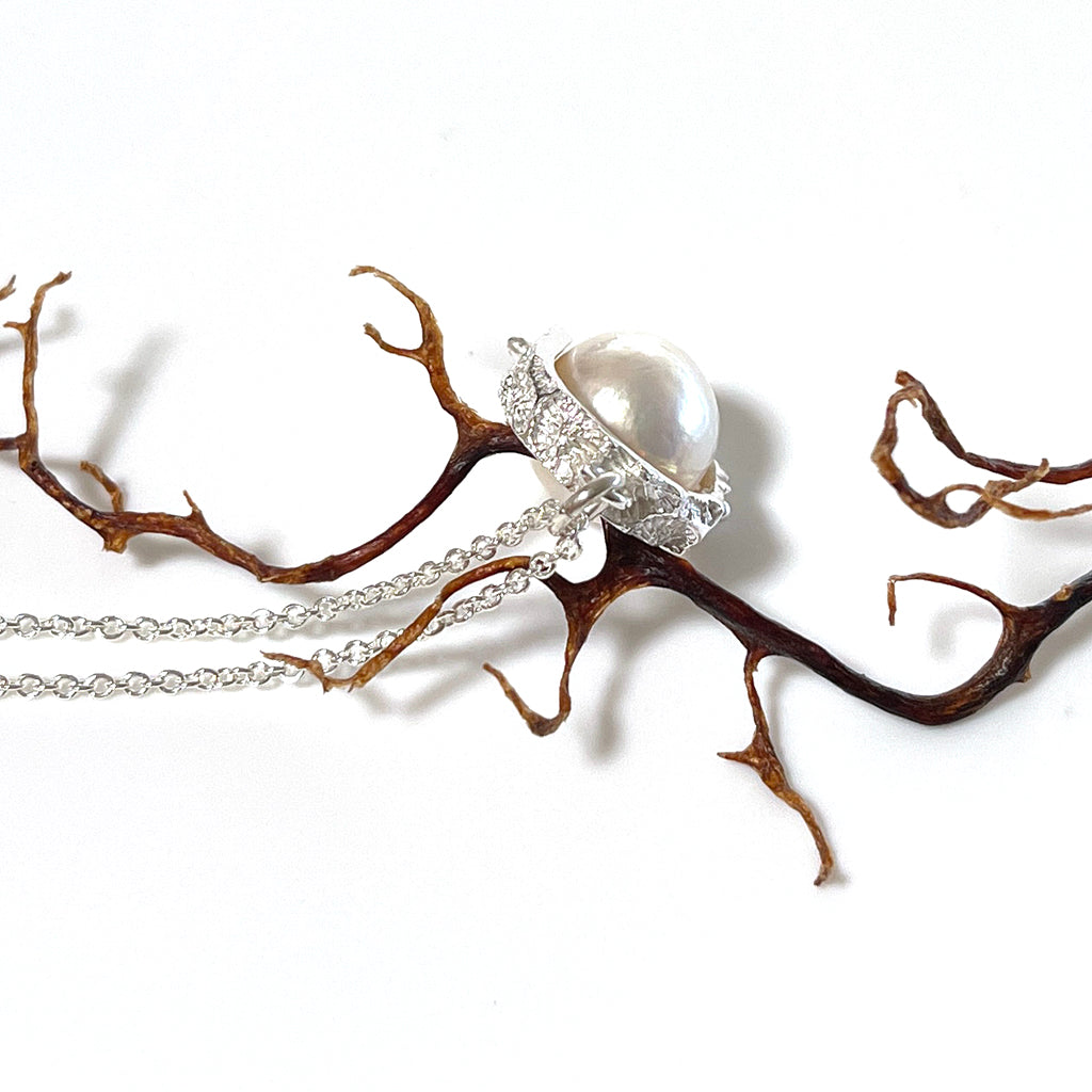 Pearl surrounded by silver with textures from the Great Barrier Reef