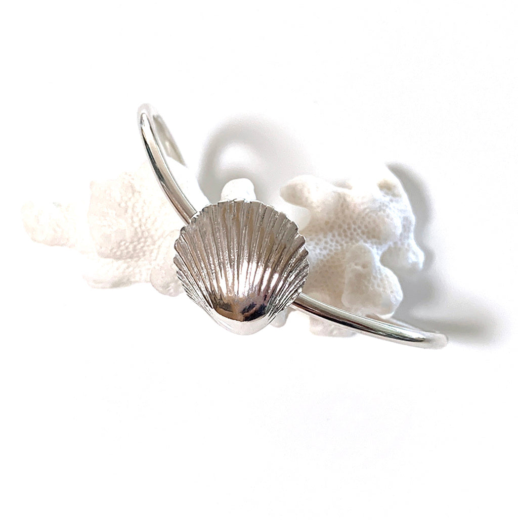 Sun Rays Sea Shell Cuff Bracelet , displayed on natural coral. Coastalstyle Australia.