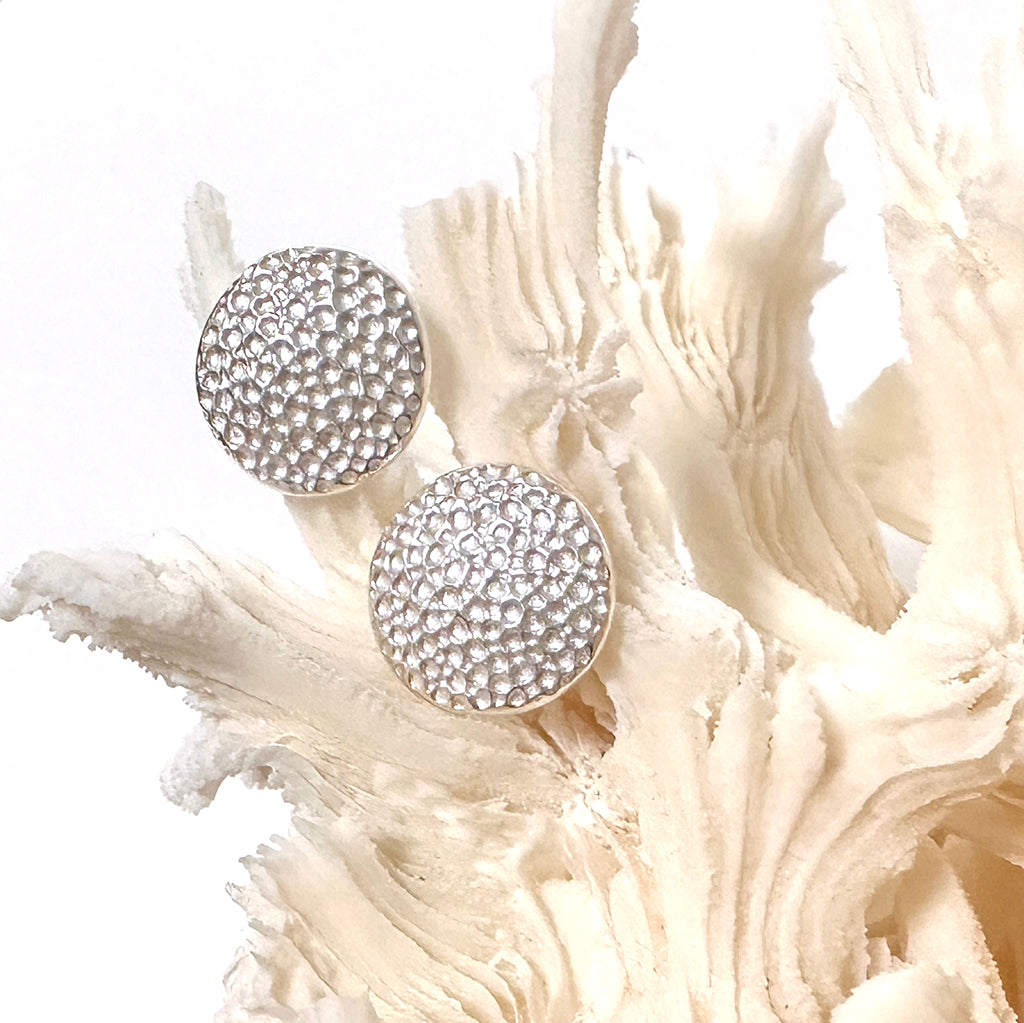 Manta Ray pure silver studs displayed on natural coral. Coastalstyle Australia.